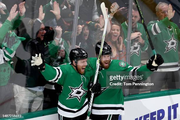 Joe Pavelski of the Dallas Stars celebrates with Jani Hakanpää of the Dallas Stars after scoring his fourth goal against the Seattle Kraken in the...