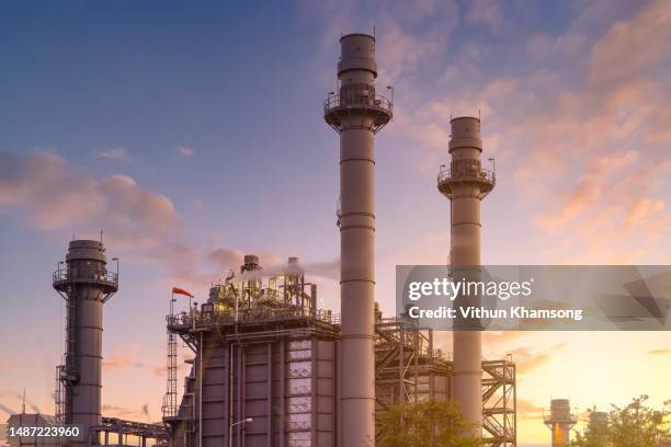 power station included steam turbine and stack tower at twilight - power station stock pictures, royalty-free photos & images