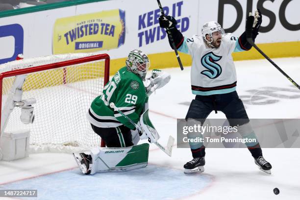 Oliver Bjorkstrand of the Seattle Kraken celebrates after Yanni Gourde of the Seattle Kraken scored the game-winning goal against Jake Oettinger of...