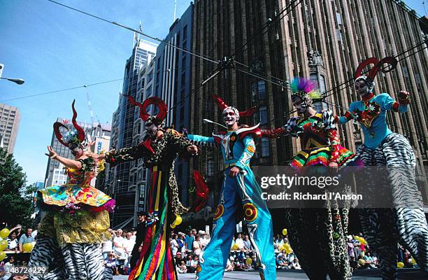 stilt walkers strut their stuff in the annual moomba parade - moomba festival parade stock pictures, royalty-free photos & images