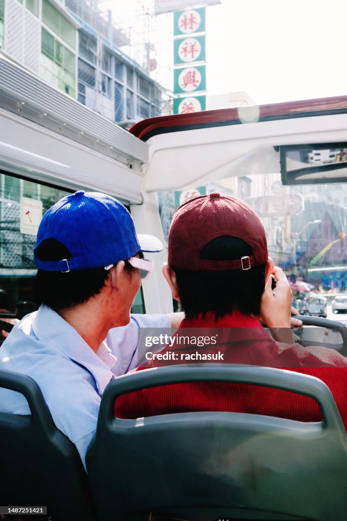 Gay male couple taking pictures