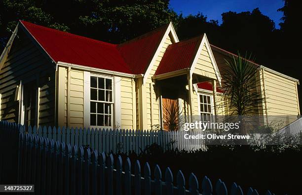 timber house with white picket fence. - white picket gate stock pictures, royalty-free photos & images
