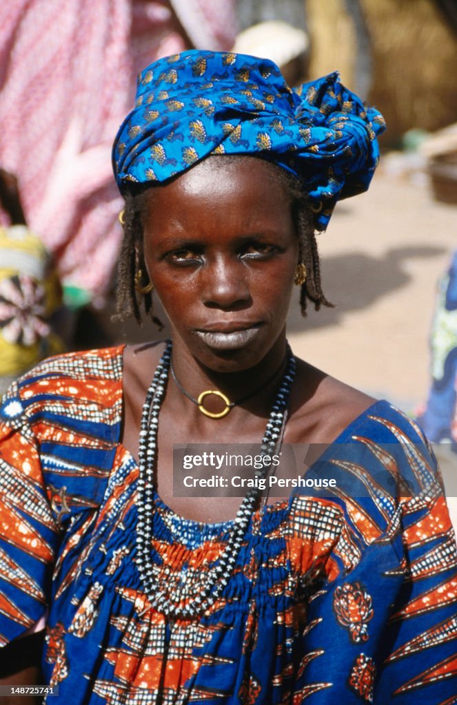 Portrait of woman at market.