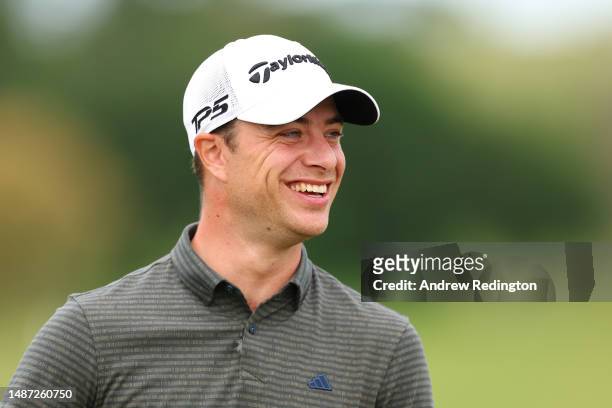 Guido Migliozzi of Italy smiles on the practice range ahead of the Pro-Am prior to the DS Automobiles Italian Open at Marco Simone Golf Club on May...