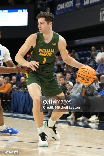 Jake Milkereit of the William & Mary Tribe dribbles the ball during the CAA Men's Basketball Championship - quarterfinal game against the Hofstra...