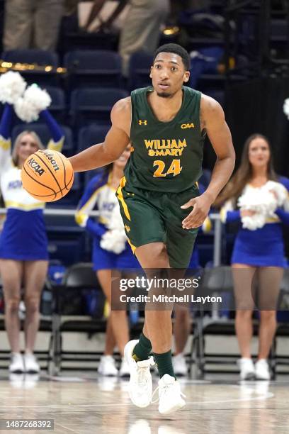 Chris Mullins of the William & Mary Tribe dribbles up court during the CAA Men's Basketball Championship - quarterfinal game against the Hofstra...