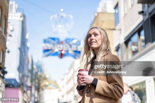 young woman in carnaby street, london - carnaby street stock pictures, royalty-free photos & images