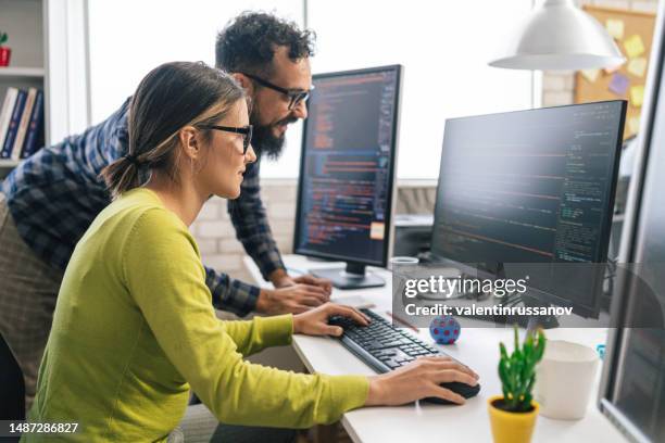 software programmers analyzing html code and database, brainstorming script ideas to develop new security system. engineers working with coding language collaborating on group project - students working on pc school stock pictures, royalty-free photos & images