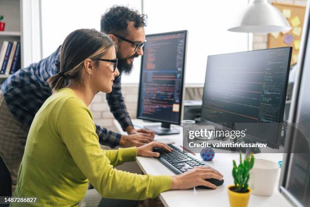 software programmers analyzing html code and database, brainstorming script ideas to develop new security system. engineers working with coding language collaborating on group project - fake stock pictures, royalty-free photos & images