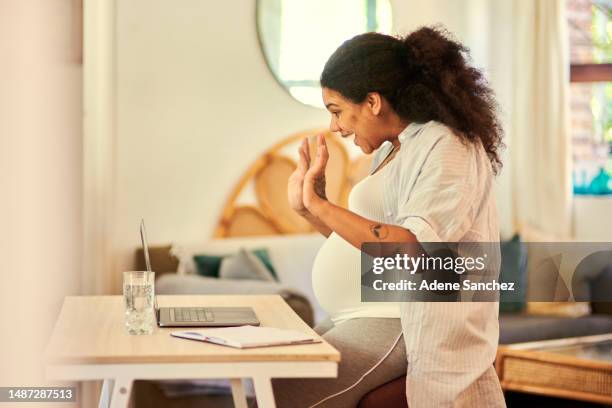 pregnant, woman and laptop for video call in home, social network and virtual communication online. pregnancy, happy female person and wave on computer with hello, voip connection and web technology - pregnant women greeting stockfoto's en -beelden