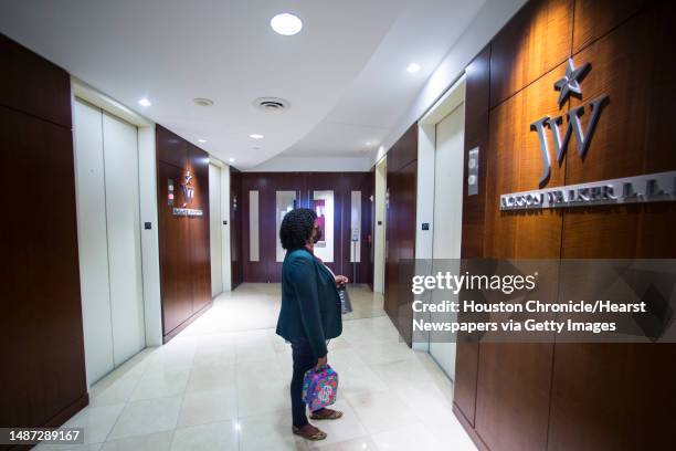 Labor and employment attorney Jamila Brinson, waits for an elevator office as she leaves for the day at the Jackson Walker law firm, where she is a...