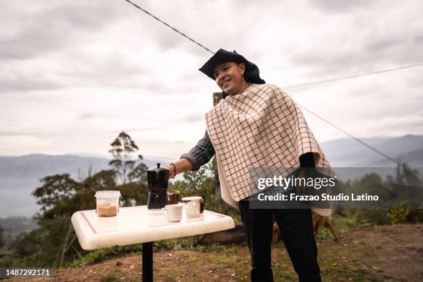 mature man making a coffee break in the farmhouse - colombian coffee mountain stock pictures, royalty-free photos & images