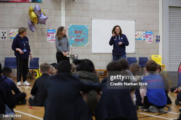 Catherine Fletcher coach of LTA's Great Britain National Deaf team interacts with school children during the Deaf Awareness Tennis Festival at...