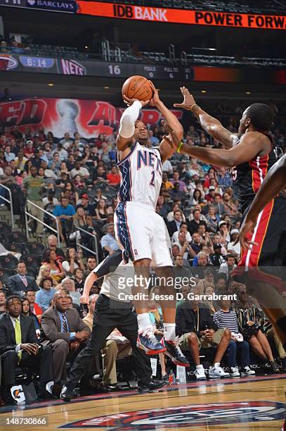 Sundiata Gaines of the New Jersey Nets shoots the ball against the Miami Heat during the game on April 16, 2012 at the Prudential Center in Newark,...