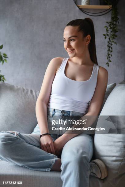 calm home vibes for cute smiling female - ponytail hairstyle stock pictures, royalty-free photos & images