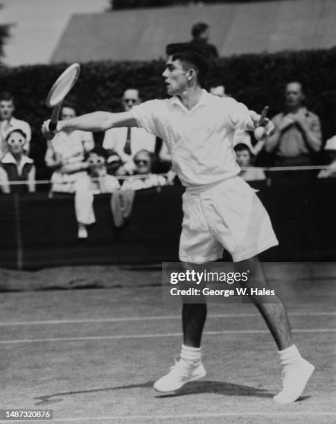 Australian tennis player Ken Rosewall in action during his match against Ivor Warwick at the Wimbledon championships, All England Lawn Tennis Club,...