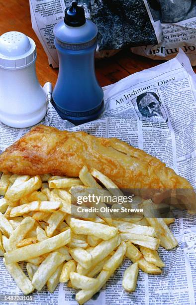 a gourmet delight of fish and chips and old newspapers - galway, county galway - county galway stock pictures, royalty-free photos & images