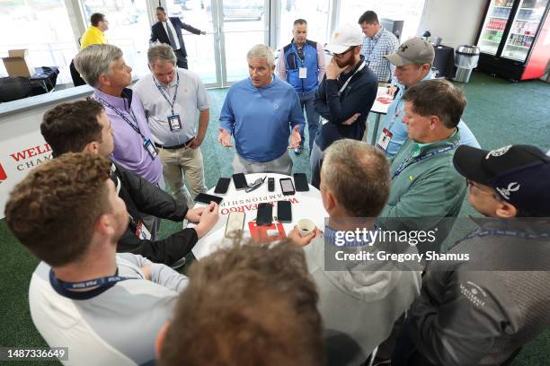 Jay Monahan, Commissioner of the PGA TOUR, talks with a group in the media center during a practice round prior to the Wells Fargo Championship at...