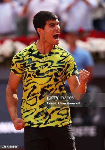 Carlos Alcaraz of Spain celebrates his straight sets victory against Karen Khachanov during the Men's Singles Quarter-Final match on Day Ten of the...