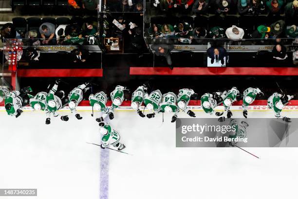 Max Domi of the Dallas Stars celebrates his empty net goal against the Minnesota Wild with teammates in the third period in Game Six of the First...