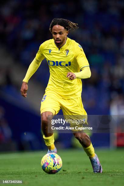 Theo Bongonda of Cadiz CF runs with the ball during the LaLiga Santander match between RCD Espanyol and Cadiz CF at RCDE Stadium on April 21 2023 in...