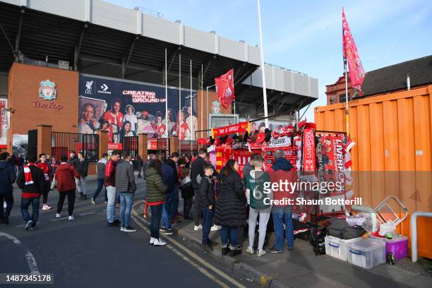 Fans are seen outside merchandise stand outside the stadium prior to the Premier League match between Liverpool FC and Fulham FC at Anfield on May...