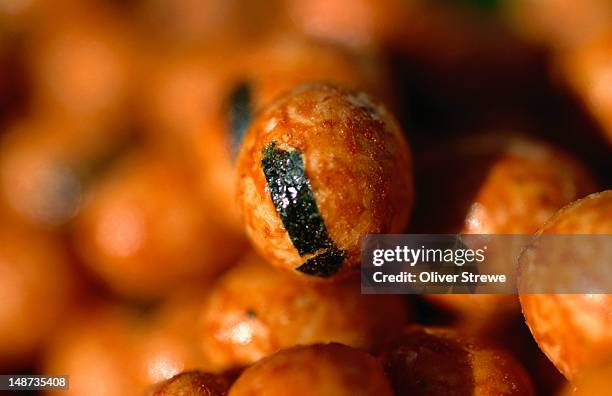 senbei, a favourite rice cracker often snacked on by many japanese. - rice cakes stock pictures, royalty-free photos & images