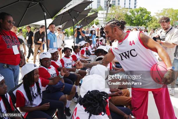 Lewis Hamilton interacts with Dibia DREAM kids during The IWC Chrono Challenge, an entertaining basketball challenge organized by IWC Schaffhausen,...
