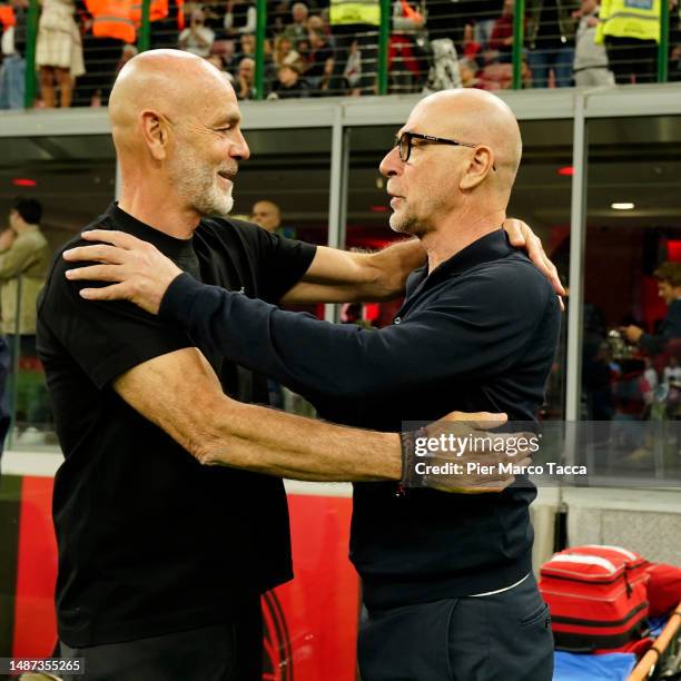 Head Coach of AC Milan Stefano Pioli cheers Head Coach of US Cremonese Davide Ballardini prior to the Serie A match between AC Milan and US Cremonese...