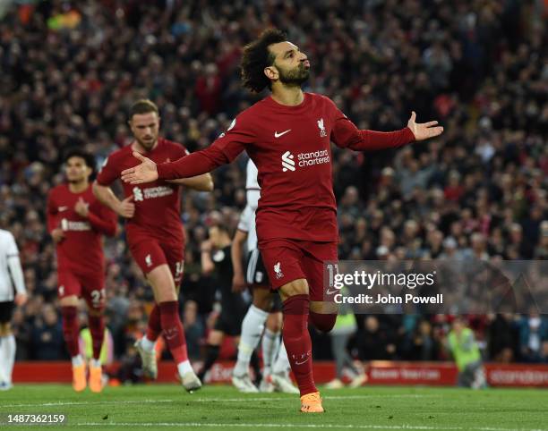 Mohamed Salah of Liverpool celebrates after scoring the first goal during the Premier League match between Liverpool FC and Fulham FC at Anfield on...