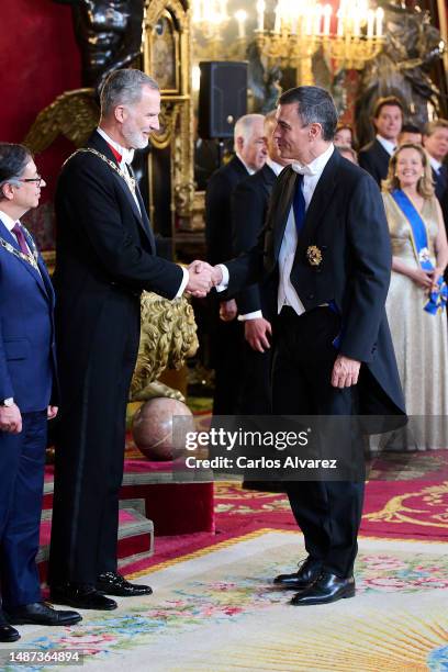 King Felipe VI of Spain greets the prime minister Pedro Sanchez before the Gala dinner for the President of Colombia Gustavo Francisco Petro and his...