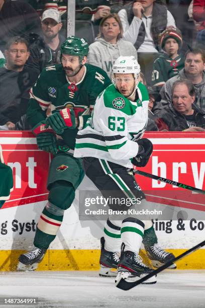 Jake Middleton of the Minnesota Wild compete against Evgenii Dadonov of the Dallas Stars in the first period of Game Six of the First Round of the...