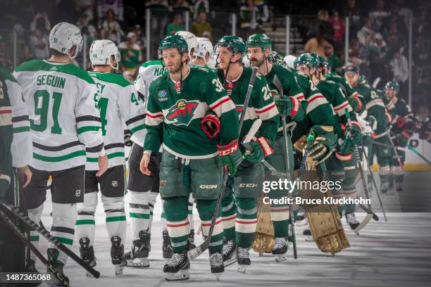 Minnesota Wild players shake hands with the Dallas Stars after losing Game Six of the First Round of the 2023 Stanley Cup Playoffs at Xcel Energy...