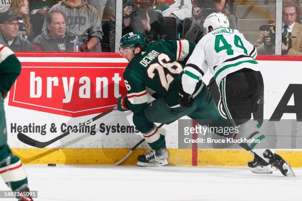 Connor Dewar of the Minnesota Wild competes with Joel Hanley of the Dallas Stars in the first period of Game Six of the First Round of the 2023...