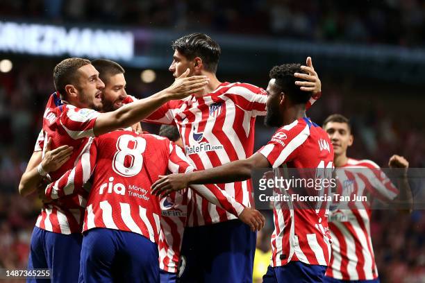 Antoine Griezmann of Atletico Madrid celebrates with teammates after scoring the team's first goal during the LaLiga Santander match between Atletico...