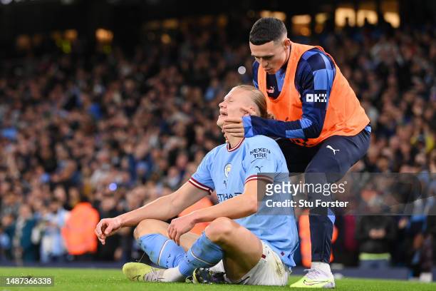 Erling Haaland celebrates with Phil Foden of Manchester City after scoring the team's second goal during the Premier League match between Manchester...