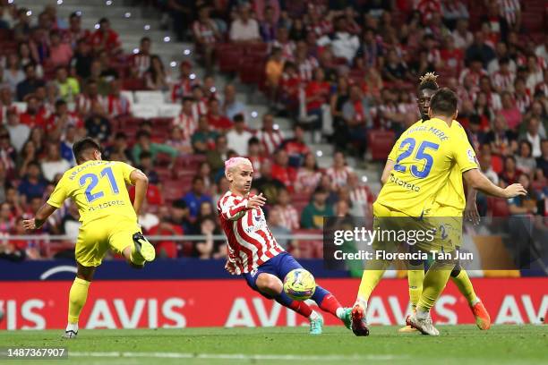 Antoine Griezmann of Atletico Madrid scores the team's second goal whilst under pressure from Santiago Arzamendia , Momo Mbaye and Jorge Mere during...