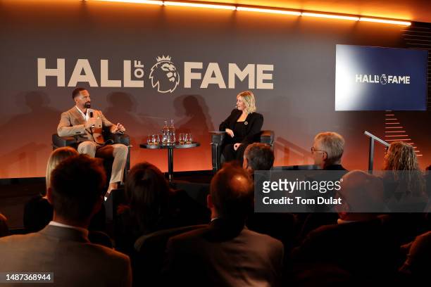 Rio Ferdinand speaks alongside Kelly Cates during a Premier League Hall of Fame event on May 03, 2023 in London, England.