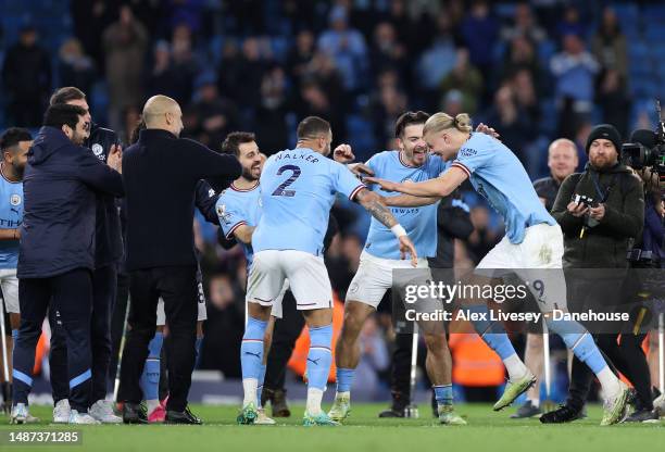 Erling Haaland of Manchester City receives a guard of honour from team mates and Pep Guardiola after breaking the Premier League scoring record...