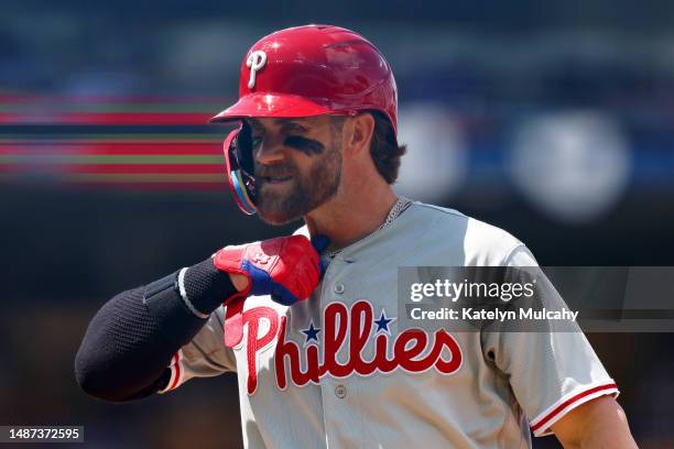 Bryce Harper of the Philadelphia Phillies reacts after hitting a single during the fourth inning against the Los Angeles Dodgers at Dodger Stadium on...