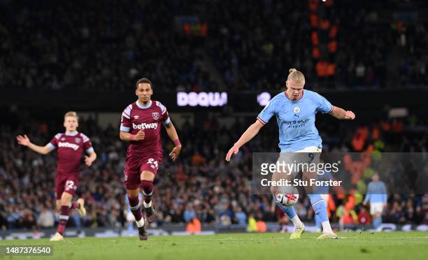 Manchester City striker Erling Haaland shoots to score the 2nd City goal and his record breaking 35th Premier League goal of the season during the...