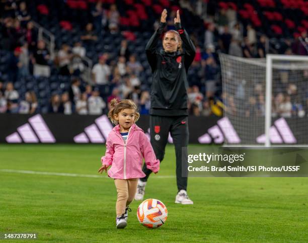 Charlie Carrasco dribbles in front of her mom, Alex Morgan of the United States after a game between the Republic of Ireland and the USWNT at...