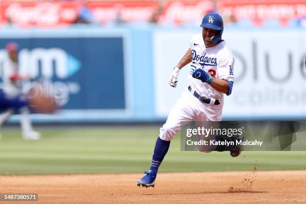 Chris Taylor of the Los Angeles Dodgers runs to third base on a triple in the seventh inning against the Philadelphia Phillies at Dodger Stadium on...