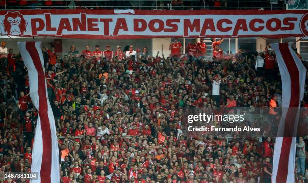 Fans of Internacional cheer their team during a Copa CONMEBOL Libertadores 2023 Group B match between Internacional and Nacional at Beira-Rio Stadium...