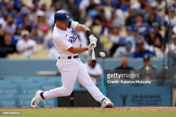 Austin Barnes of the Los Angeles Dodgers hits a two-run single to take a 6-5 lead in the eighth inning against the Philadelphia Phillies at Dodger...