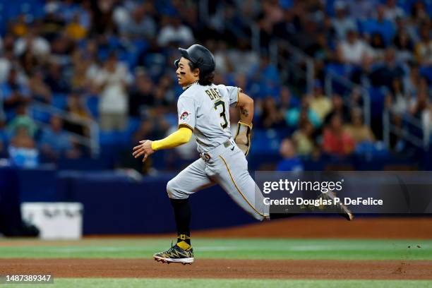 Ji Hwan Bae of the Pittsburgh Pirates runs the bases on a wild pitch during the fourth inning against the Tampa Bay Rays at Tropicana Field on May...