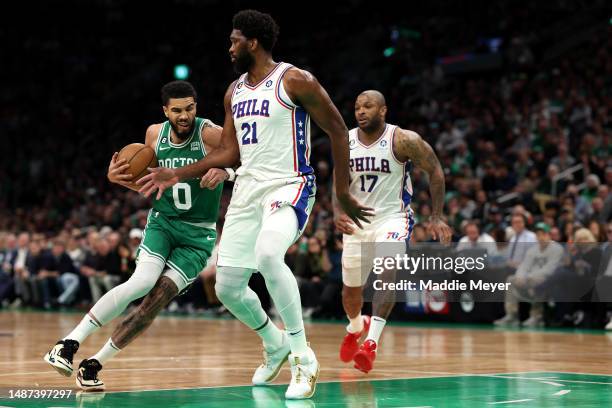 Joel Embiid of the Philadelphia 76ers defends Jayson Tatum of the Boston Celtics during the first quarter of game two of the Eastern Conference...