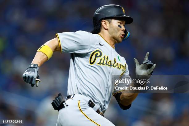 Ji Hwan Bae of the Pittsburgh Pirates runs to first base on a bunt during the fourth inning against the Tampa Bay Rays at Tropicana Field on May 03,...