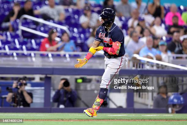 Ronald Acuna Jr. #13 of the Atlanta Braves rounds the bases after hitting a home run against the Miami Marlins during the fifth inning at loanDepot...