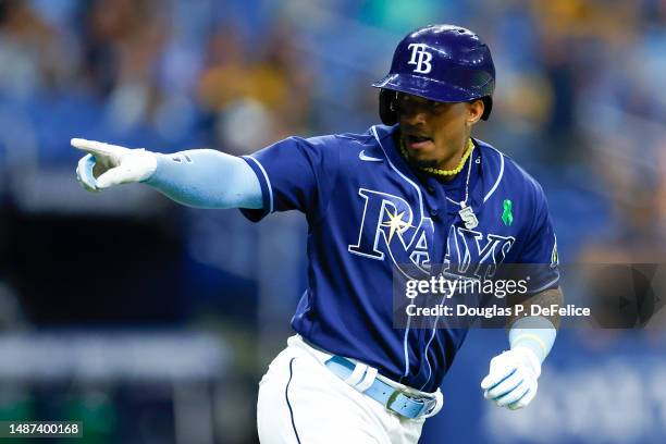 Wander Franco of the Tampa Bay Rays reacts after hitting a solo home run during the seventh inning against the Pittsburgh Pirates at Tropicana Field...
